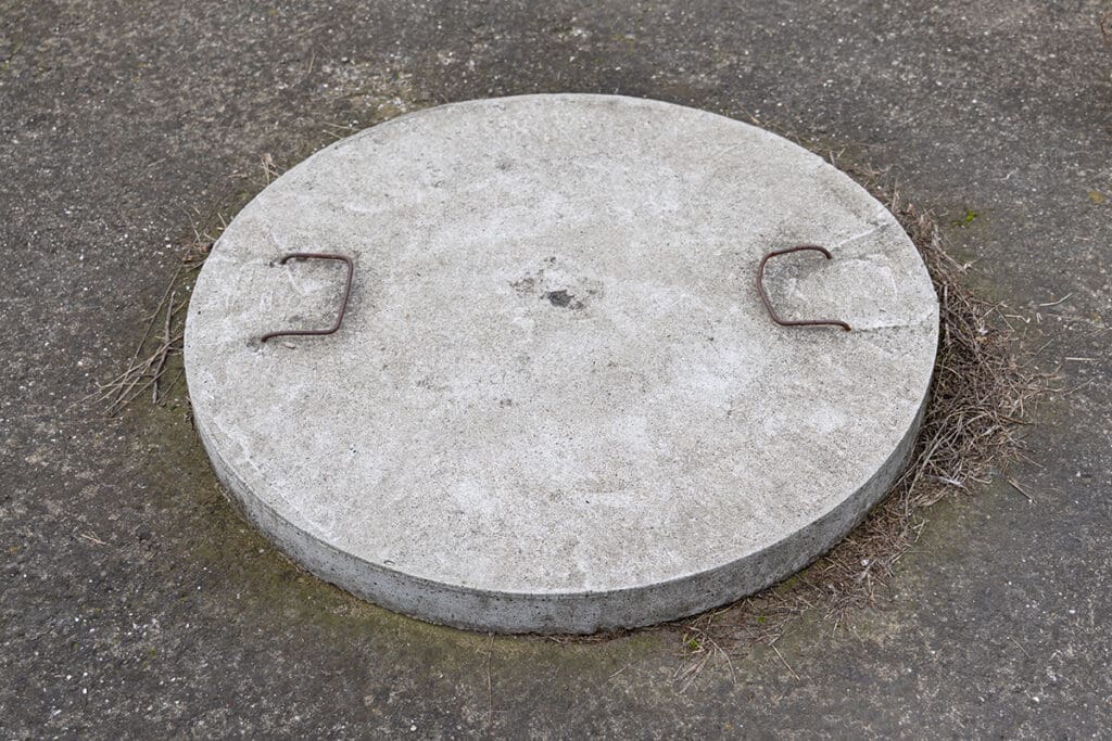 A concrete septic tank cover