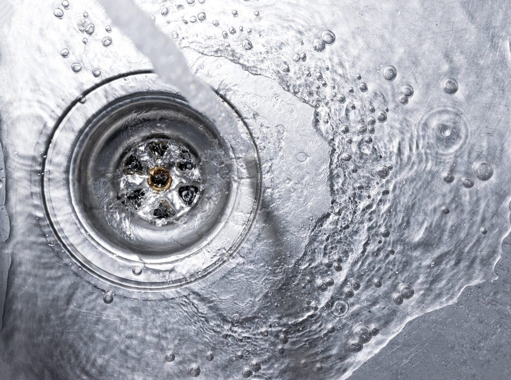 Water washing down a drain