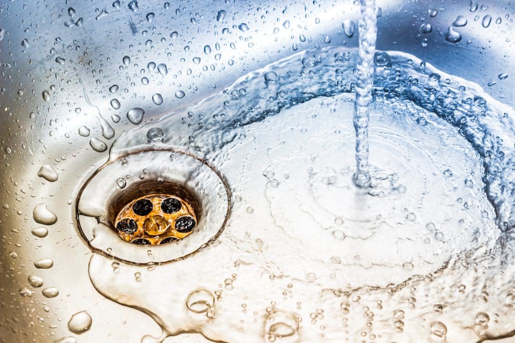 water running into a clear drain